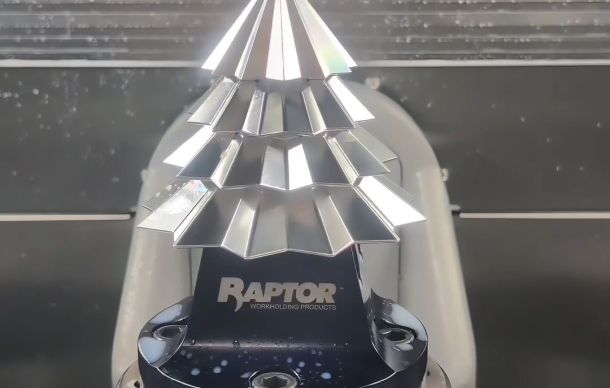 graphite-manufacturing Precision-machined starburst aluminum part on a Raptor workholding fixture.